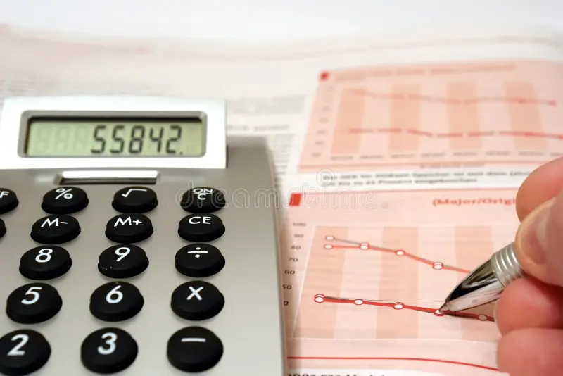 Pocket calculator and paper account statements on a desk, representing retirement planning by spreadsheet and guesswork